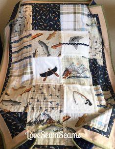 a quilted blanket with birds and fish on it