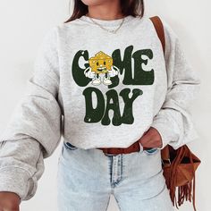 ✓ Green Bay Shirt ✓ Wisconsin Sweatshirt ✓ Cheese Head Vintage Crewneck ✓ Green Bay Game Day Sweatshirt ⭐️Super Soft Gildan 18000 Sweatshirt: *50% cotton, 50% polyester (fiber content may vary for different colors); *Medium-heavy fabric; *Classic Fit; *Double-needle stitching at shoulders, armholes, neck, waistband and cuffs. IMPORTANT: Please keep in mind that when a light color ink is placed on dark-colored garments, it has a vintage appearance. Also note that due to monitor/device resolutions and lighting conditions, colors can vary to a degree from what you see on your screen. ⭐️Size guide: This hoodie runs true to size so, if you like to be extra comfy and prefer oversized fits, just like us, then we definitely suggest sizing up one or two sizes from your original size! The size chart Packer Sweatshirt, Football Crewneck, Game Day Sweatshirt, Sunday Football, New York Football, Buffalo Games, Buffalo Football, Football Sunday, Football Football