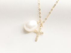 Tiny Cross with Pearl Necklace / Miraculous Necklace / Pearl / Catholic Necklace / Gold Necklace with Cross / Baptism / Gold Filled - Gold Filled 8X15mm Cross Charm - Baroque Pearl - Material: 14k Gold Filled AVAILABLE LENGTH + 16 inches Round Flat Gold Filled + 17 inches Round Flat Gold Filled + 18 inches Round Flat Gold Filled - Pendant and Chain Material: Gold Filled - Water-resistant, tarnish free, hypoallergenic, nickel free and safe for sensitive skin Please note: since our baroque pearls Cross Pendant Necklace With Pearl Drop Gift, Pearl Drop Cross Necklace Gift, Pearl Drop Cross Pendant Necklace For Gift, Gift Pearl Charm Cross Pendant Necklace, Pearl Charm Cross Necklace For Gift, Cross Necklace With Pearl Charm For Gifts, Cross Necklace With Pearl Charm As Gift, White Crucifix Pearl Necklace As A Gift, White Cross Necklace For Baptism