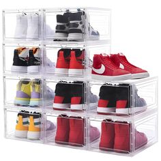 six clear acrylic shoe storage bins with various pairs of shoes in them