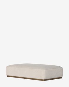 an upholstered mattress with no sheets on the top and bottom, in front of a white background