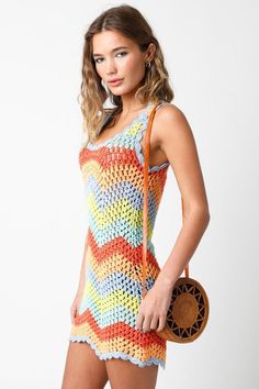 The Mahalo Multi-Color Crochet Cover-Up Dress will be the first thing packed in your suitcase for your next vacation! Multi-color crochet knit shapes this round neck mini dress with an asymmetric hem and thick straps. Style over a bikini with your favorite sandals and instantly look put together! DETAILS & FIT S: 29" length, 30" waist, 32" bust M: 29.5" length, 32" waist, 34" bust L: 30" length, 34" waist, 36" bust Fitted. 100% Acrylic. Hand Wash Cold. Imported Multi Color Crochet, Look Put Together, Crochet Cover, Boho Pink, Crochet Dresses, Crochet Cover Up, Dress Boho, Scalloped Hem, Cover Up Dress