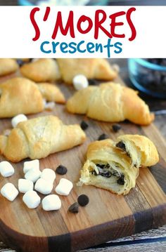 s'mores crescent pastries on a cutting board with marshmallows