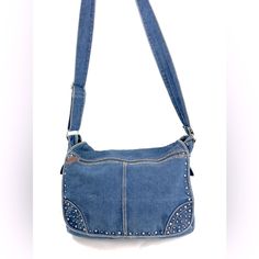 Denim!! You Know You Need More. This Unisex Unbranded Blue Denim Large Messenger Crossbody Bag Has Super Fun Studs On The Front. There's Also A Long Zipped Pocket On The Front. The Sides Have Hook & Loop Flap Pockets. Under The Flap Is A Large Hook & Loop Pocket. There's Also A Zip Around Pocket And 2 Slip Pockets. Inside The Main Zipped Section Are No Pockets. Very Good Condition. Minimal Normal Wear. This Is A Pre-Owned Item And May Have Fading Or Discoloration, Marks Or Stains, Scratches, Wri Casual Blue Shoulder Bag With Snap Closure, Denim Blue Shoulder Bag With Cell Phone Pocket, Casual Denim Shoulder Bag With Cell Phone Pocket, Denim Blue Bags With Double Handle And Pockets, Blue Denim Bag With Cell Phone Pocket, Denim Blue Crossbody Bag With Pockets, Blue Denim Shoulder Bag With Adjustable Strap, Denim Shoulder Bag With Adjustable Strap, On-the-go Double Handle Denim Shoulder Bag