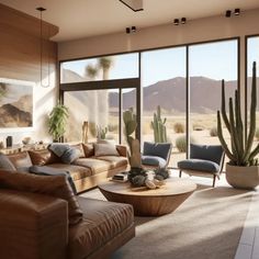 a living room filled with lots of furniture and large windows next to a desert landscape