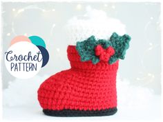 a crocheted boot with a bow on the side and a christmas tree in the background