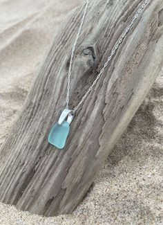 Light Aqua Blue Sea Glass, Sterling Silver Necklace, Lake Michigan Genuine Beach Glass, Perfect Gift or for Yourself, Free Shipping This is a classic, elegant beach glass pendant necklace accented with a sterling silver bail. An 18 inch sterling silver chain can be included. This handmade beach glass jewelry gift is from authentic beach glass hand-picked on the shores of Lake Michigan. Each piece is unique and at jewelry grade quality. The necklace photos on the listing are the exact item you will receive. A beautiful silver jewelry box is included. Sea glass dimension: 0.625 x 0.5 inches FREE Shipping to all U.S. mainland addresses by USPS First Class Package. Check out other sea glass items from my shop:  www.etsy.com/shop/ashleesalchemy Beach Pendant Jewelry With Recycled Glass, Ocean-inspired Silver Glass Necklace, Turquoise Sea Glass Necklace For Beach, Ocean-inspired Sea Glass Necklaces For Beach, Turquoise Glass Beach Jewelry, Beach Turquoise Glass Jewelry, Blue Nickel-free Necklace For Beach, Nickel-free Blue Necklace For The Beach, Clear Glass Jewelry For Beach