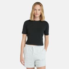 This women's cropped t-shirt is extra comfy thanks to fabric made with a hint of stretch and 95% organically grown cotton free of genetically modified seeds, synthetic fertilizers or pesticides. This easy, breezy silhouette looks cute with everything in your closet, so you'll find yourself styling it with shorts, skirts, overalls and joggers all season long. Baby Timberlands, Timberland Women, Women In Black, Cardigan Shirt, Timberlands Women, Baby T Shirts, Cropped T Shirt, Slim Fit Shorts, Baby T Shirt