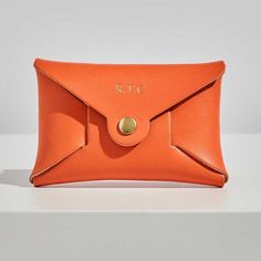 Made from bold orange leather, this coin purse is the perfect sunset shade.Our personalised leather coin purses are the perfect size for when you don’t need your full wallet: night’s out, holidays, travelling light. With initials on the front and a secret message printed inside, they are the perfect gift for Mum on Mother’s Day, your best friend’s birthday, Christmas stocking filler, a treat for yourself.Handmade from sustainably sourced, premium quality British leather and made in the UK, at ou Leather Change Purse, Card Purse, Stocking Filler Gifts, Origami Design, Christmas Stocking Fillers, Leather Coin Purse, Gift For Mum, Secret Messages, Best Friend Birthday