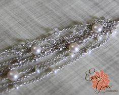 "This 8 strand bracelet is made of sterling silver and dazzling clear quartz faceted gemstones and a generous number of white freshwater pearls in two sizes. Would be an amazing bracelet for a bride! This a elegant addition to your jewelry collection and handcrafted just for you in the size you request. Each bracelet made will vary slightly to accommodate the size requested. Bracelet arrives neatly packaged and ready to wear and enjoy, or give as a gift! {WHAT * YOU * WILL * GET} - - - - - - - - Elegant Silver Beaded Bracelets With Gemstones, Elegant Pearl Bracelet With Gemstone Beads, Elegant Rondelle Faceted Pearl Bracelet, Elegant Silver Bracelets With Gemstone Beads, Elegant Silver Bracelet With Gemstone Beads, Elegant Double Strand Bracelets With Gemstone Beads, Elegant Multi-strand Beaded Bracelets With Faceted Beads, Elegant Double Strand Gemstone Beads Bracelets, Elegant Multi-strand Faceted Beads Bracelets