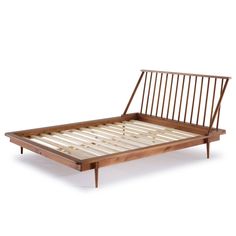 the bed frame is made out of wood and has slats on top of it