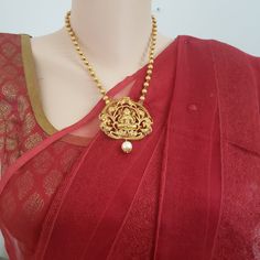 "Handmade Indian Temple Jewelry, best to wear it for traditional ceremonies or Indian wedding. This bridal jewelry has ethnic finish. It has Cubic Zircon stones with ruby and emeralds. It is a Bollywood style one gram jewelry. There are long and short patterns of Indian jewelry in Kundan, Pearls, CZ, American Diamond , ruby, emerald, Polki, kemp to suit every occasion of South Indian and North Indian weddings. Handmade Indian Jewelry item * Stunning Hand made Temple jewelry set. * Necklace Set i Indian Jewelry Traditional, Jewelry Traditional, Long Haram, Traditional Indian Jewellery, Temple Jewelry, Indian Temple, South Indian Jewelry, Bollywood Style, Bollywood Jewelry