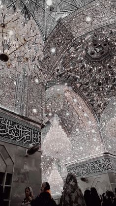 an ornate ceiling with chandeliers and lights in the middle is decorated with snowflakes