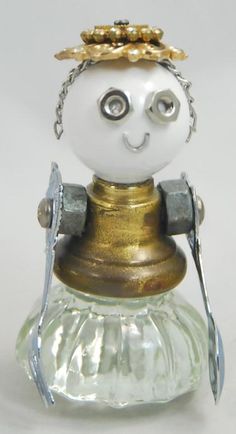 a glass figurine with a gold crown on it's head