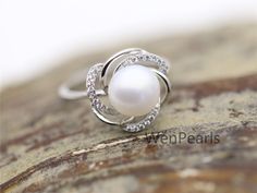 "This pearl ring is made of 9mm AAA genuine freshwater round pearls, setting with sterling silver and crystal mount, size is adjustable, it is a open ring. Gift for wedding, birthday, friend,anniversary gifts. ~Jewelry: Genuine Pearl Ring,S925 Sterling Silver Ring ~Natural Freshwater pearls ~Pearl Luster: High,good ~Pearl skin: clean ~Pearl Shape: Button Round ~Pearl Color: white ~Pearl Size: 10mm ~Pearl quality: AAA ~Metal: sterling silver with rhinestone,NICKLE FREE, ~Ring size: suitable finge Cubic Zirconia Pearl Ring With Prong Setting For Promise, Round Pearl Promise Ring With Prong Setting, Round Cubic Zirconia Pearl Ring For Anniversary, Anniversary Pearl Ring With Cubic Zirconia, Diamond White Round Pearl Promise Ring, Diamond White Pearl Promise Ring, Gift Pearl Ring With Cubic Zirconia In Prong Setting, Silver Pearl Ring With Prong Setting, Fine Jewelry Pearl Ring With Cubic Zirconia