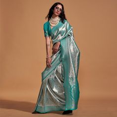 Rama Blue color saree is made from kanjivaram silk fabric which is highlighted with beautiful weaving work as shown. comes along unstitched jacquard blouse piece which you can customise as per your design/style. Occasion - You can wear this saree for festive and functions. Note:- the actual product may differ slightly in color and design from the one illustrated in the images when compared with computer or mobile screen. Measurements: Saree : KanjiVaram : 5.5 Mtrs Blouse : KanjiVaram Silk : 0.8 Mtr Material: KanjiVaram Silk Stitch Type: Unstitched Country of Origin: India Care Guide: Dry Clean Navratri Brocade Saree, Brocade Saree With Zari Weaving, Designer Silver Saree For Diwali, Silver Anarkali Saree In Traditional Drape, Anarkali Silver Saree With Traditional Drape, Silver Banarasi Silk Blouse Piece With Zari Weaving, Silver Banarasi Silk Blouse Piece In Traditional Drape, Silver Unstitched Saree With Zari Weaving, Silver Banarasi Silk Blouse Piece For Saree