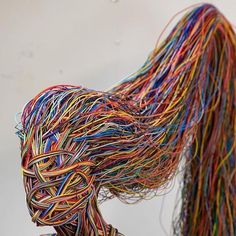 a sculpture made out of wires on top of a table