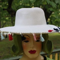 New With Tags Mud Pie White Floppy Hat With Multi Colored Tassels Navy Blue Work Along The Outside Brim Just Before Tassels This Hat Is Adorable Tag States One Size Fits Most Approx Inside Where Head Goes: 7 1/2" Brim: 4" Tassels 1 1/2" Long Bought New Never Wore. Stored In Hat Box Non Smoking Adjustable Fringe Hat For Spring, Wide Brim Spring Hat With Fringe, Spring Sun Hat With Fringe And Curved Brim, White Casual Wide Brim Hat For Festivals, Casual White Hat For Festival With Wide Brim, Fringed Fedora Sun Hat For Spring, Summer Sun Hat With Fringe For Spring, Casual Adjustable Sun Hat With Fringe, Fringe Sun Hat For Spring And Summer