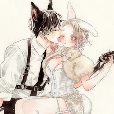 a man and woman dressed up as cats kissing in front of a white background with black cat ears