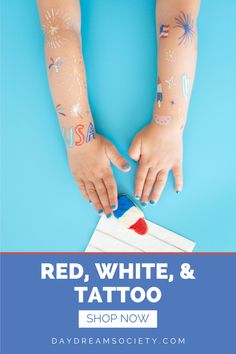 two hands with red, white and blue tattoos on their arms holding a toothbrush