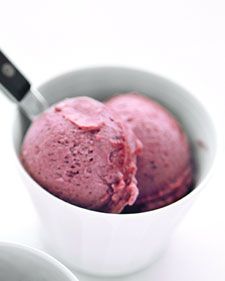 two bowls filled with ice cream on top of a white table next to each other