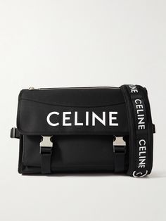 Steered by visionary Creative Director Hedi Slimane, CELINE HOMME stands at the forefront of contemporary luxury. This messenger bag is made from hard-wearing nylon-canvas and printed with the house logo in its signature typeface. There's enough space inside for the essentials and two buckles to keep everything safe. Modern Evening Shoulder Bag With Logo Strap, Modern Travel Shoulder Bag With Logo Strap, Designer Nylon Shoulder Bag For Evening, Mens Messenger Bag, Messenger Bag For Men, House Logo, Hedi Slimane, Canvas Messenger Bag, Contemporary Luxury