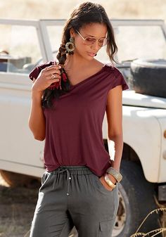 This casually feminine top has playful detailing. Slight v-neckline. Short sleeves with flounce detailing. Lace shoulder inserts. Straight hem. Length approx. 24.5 inches. Viscose/elastane; lace trim: cotton. Imported. Machine wash cold with like colors, inside out. Hang to dry or lay flat. Casual V-neck Top In Viscose For Summer, Casual Viscose V-neck Top For Summer, Casual Stretch V-neck Top For Summer, Stretch Summer Blouse, Stretch Elastane Summer Blouse, Feminine Top, Braided Sandals, Buy Wine, Women's Wear