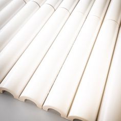 several white pipes lined up in a row