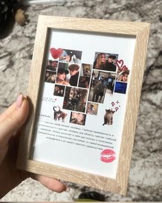 a person holding up a wooden frame with pictures on it and the words love is in red