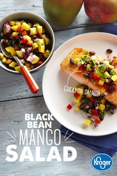 a white plate topped with fish and mango salsa next to two bowls filled with fruit