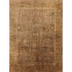 an antique rug with many different colors and patterns on the carpet, including beiges and browns