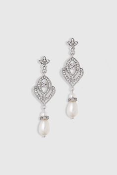 two pairs of earrings with pearls and diamonds on the front, one in white gold