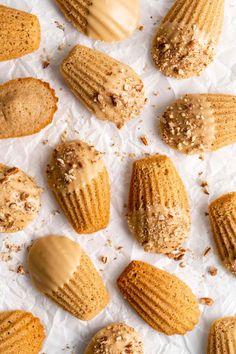 several peanut butter cookies are arranged on wax paper