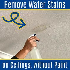 a person painting a ceiling with the words remove water stains on ceilings, without paint