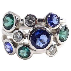 Thomas Leyser is renowned for his contemporary jewellery designs utilizing fine gemstones. This 18k white gold (9.39g) ring is set with 3x fine Sapphires (round, 4-6mm, 2.98ct) + 3x fine Tourmalines (4-5mm, 1.26ct) + 3x Diamonds (brillant-cut, 3mm, G/VS, 0.35ct). Ringsize: 7 (54.5) Contemporary Jewelry Design, White Gold Sapphire, Sapphire Jewelry, White Gold Ring, Three Stone Rings, Contemporary Jewellery, Jewellery Designs, Three Stone, White Gold Rings