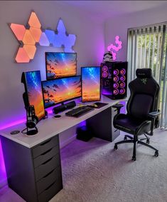 a computer desk with three monitors and two keyboards