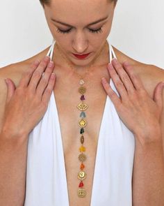 The chakra yoga jewelry for women charm necklace was designed for you to gaze at during your yoga practice, or wear to represent your yoga practice. The intent of this yoga necklace is to be mindful and bring awareness to your chakra energy points. The yoga chakra charm pendants for jewelry making and adding a sense of harmony and balance to yourself and your environment. Gazing at the symbols and colors of this woman’s necklace jewelry will heighten your sense of confidence, inspiration, and id Chakra Jewelry Stone, Luxury Hand-strung Jewelry For Meditation, Cheap Symbolic Beaded Jewelry, Affordable Spiritual Jewelry With Large Pendant, Cheap Spiritual Jewelry With Large Pendant, Cheap Spiritual Charm Necklaces, Cheap Spiritual Round Bead Jewelry, Luxury Unique Jewelry For Meditation, Symbolic Handmade Necklaces