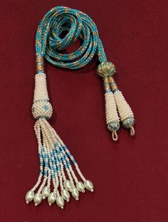 "Adjustable Handmade Necklace Thread, Indian Necklace Jewelry Necklace Cord with Beaded Tassels, Zari Dori Jewelry Supplies.. Bright and beautiful adjustable handmade necklace thread / SEA BLUE necklace cord with beaded tassels and brass lobster clasps. All the colors are Available Only on \"Special Requirement of Buyer\"  ON BULK Purchases Special Discount Shall Also be Provided Depending on Size and lot of Orders.. Also all Colorful Threads are Fully Handmade with Silk Thread..   Buyers Might Also See Slight Variations in Color Like Dark or Light.. Due to Picture Quality.. No Compromise on Our Product On Our Side. Looks good with big pendants or chokers can see in the picture. SIZE: 11 inches can go upto 18 inches ( 9 inches each side ) Only On *Special Demand*. You Will receive one Piec Turquoise Beaded Necklaces With Tassels For Gift, Traditional Beaded Necklace With Tassels, Traditional Handmade Adjustable Tassel Necklace, Turquoise Beaded Necklace With Tassels And Round Beads, Blue Beads For Jewelry Making And Festivals, Turquoise Beaded Necklace With Tassels, Blue Beaded Tassel Long Necklace, Blue Beaded Long Tassel Necklace, Blue Beaded Tassel Necklace