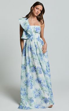 Amalie The Label - Fleur Halter Ruffle Detail A Line Maxi Dress in Elysian Print | Showpo USA A Line Maxi Dress Formal, Blue Printed Bridesmaid Dresses, Floral Ruffled Maxi Dress For Party, Ruffled Dresses For Vacation Garden Party, Floral Print Party Dress With Ruffled Straps, Party Dresses With Floral Print And Ruffled Straps, Chic Floral Print Maxi Dress With Ruffled Straps, Chic Floral Dress With Ruffled Straps, Feminine One Shoulder Floral Print Maxi Dress