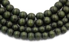 three strands of dark green wood beads