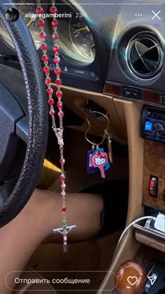 the interior of a car is decorated with beads and charms