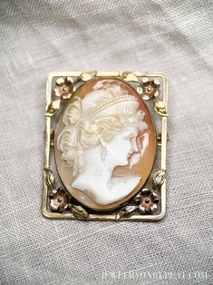 *Antique Floral Frame Cameo *10k Gold *Shell Cameo *Natural, Hand-carved *27 x 35 mm cameo, 33 x 40 mm overall *Circa 1940s Quality You Can Trust *Authenticated by a GIA Graduate Gemologist  *Detailed Quality Control and Careful Restoration *5 Star Customer Service. Questions? Send us a message! Timely Processing *Fast & Free Shipping! *Professional Ring Sizing in only 5-10 business days *Personalized Delivery for Gifts or Special Occasions Happiness, Guaranteed * 30 Day Returns and Exchanges Mo Antique Floral, Vintage Fine Jewelry, Vintage Cameo, Recycled Jewelry, Gold Confetti, Floral Frame, Retro Jewelry, Cameo Brooch, Floral Jewellery