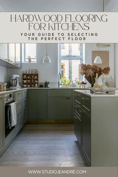 the interior of a kitchen with gray cabinets and white walls, is featured in this article