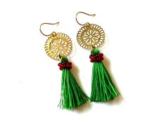 Love these colorful and lightweight tassel earrings!  You will get so many compliments on them! The gold toned earrings have green thread tassels that dangle from a brass filigree charm. Nickel free metal. They dangle about 2.5" (62 mm) long. Only one pair is available...will you be the one to wear them? Green Tassel Drop Earrings, Bohemian Gold Tassel Earrings Gift, Gold Bohemian Tassel Earrings For Gift, Green Tassel Earrings As Gift, Green Tassel Earrings With Latkans For Gifts, Adjustable Green Jewelry With Tassels, Gold Bohemian Tassel Earrings For Festive Occasions, Green Tassel Dangle Earrings, Green Dangle Tassel Earrings With Fringe