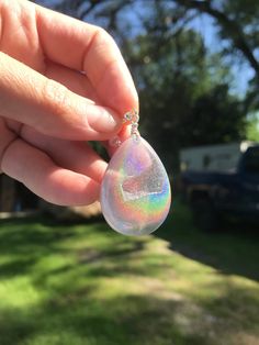 These holographic Teardrop geode earrings made from resin shift from clear to a beautiful sparkly rainbow. They are lightweight and won't bother your ears. Made by Katie Glover Resin Art by Katie 2020 Contact me on my Instagram @123pour if you would like additional photos or videos of this product.Please be aware that this is handmade art and perfection has no place in art. However, this was crafted with love and intention and I hope you are satisfied with your purchase. Your purchase is not ref Iridescent Sparkling Jewelry Gift, Iridescent Sparkling Jewelry As Gift, Sparkling Iridescent Jewelry As Gift, Sparkling Iridescent Jewelry For Gifts, Hypoallergenic Rainbow Drop Earrings, Unique Iridescent Teardrop Earrings, Iridescent Resin Drop Earrings, Iridescent Dangle Resin Earrings, Iridescent Hypoallergenic Drop Earrings