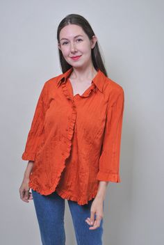 Vintage quarter sleeve orange bertha blouse, Size M Welcome to TARASCOMMON.ETSY.COM Unique clothing from the 20th century. Model tall - 170cm. Size: M. Sleeve - 28cm/ 11.02inch; Width - 50cm / 19.68inch; Length - 67cm / 26.37inch. All measurements are taken seam to seam while lying flat. Polyester.  This item is vintage, so it can have some defects. Additional photos can be send We are glad that you are interested in lots that we sell. Wish you a good shopping! FOLLOW US : Instagram: https://www Orange Collared Blouse For Fall, Orange Cotton Blouse For Work, Vintage Solid Summer Blouse, Orange Long Sleeve Cotton Blouse, Orange Long Sleeve Blouse With Ruffles, Ruffled 3/4 Sleeve Blouse For Work, Orange Collared Blouse For Spring, Spring Orange Collared Blouse, Orange Short Sleeve Blouse With Ruffles