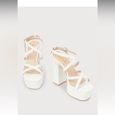 Any Dancefloor-Ready Look Wouldn't Be Complete Without A Statement-Making Addition Like The Lulus Cayleen White Platform Ankle Strap High Heels! Smooth Faux Leather Shapes These Sensational Heels That Feature A Squared-Toe Upper (Atop A 1.5" Toe Platform) And Slender Straps That Create A Crisscrossing Vamp. Matching Crisscrossing Straps Sprout From The Sides, Thread Through A Supportive Heel Strap, And Secure Around The Ankle With A Shiny Silver Buckle. A Sky-High Block Heel Will Ensure That You White Synthetic Block Heels With Heel Loop, White Synthetic Block Heels For Party, White Synthetic Block Heels For Formal Occasions, Formal White Synthetic Block Heels, White Platform Block Heels For Formal Occasions, White Platform Block Heels For Formal Events, Formal White Platform Block Heels, White Strappy Wedding Sandals, White Strappy Heels With Padded Heel