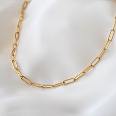 "Chunky and trendy, this necklace features thick chain links that measure 5 mm wide. 18K gold-plated stainless steel features a deeper, more saturated yellow color compared to 14K gold filled items. tarnish-resistant, water-resistant, and hypoallergenic. Lengths 13 inches and under will come with an additional 2 inch extension so that you can adjust it to fit perfectly and comfortably. --------------------♥ PROMOS ♥-------------------- Want 10% off? Join the mailing list by visiting http://bit.l Everyday Link Chain Necklace With Paperclip Chain, Everyday Paperclip Chain Link Necklace, Gold Paperclip Link Chain Necklace, Minimalist Paperclip Bracelet With Chunky Oval Links, Paperclip Chain Necklace As A Gift, Gold Paperclip Chain Necklace With Rectangular Links, Gold Paperclip Chain Necklace, Everyday Paperclip Bracelet With Figaro Chain, Gift Paperclip Chain Necklace