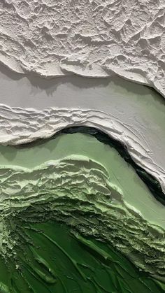 an abstract painting with green and white colors on the water's surface, as well as waves