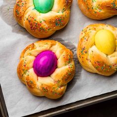 four different types of pastries with colored eggs in them